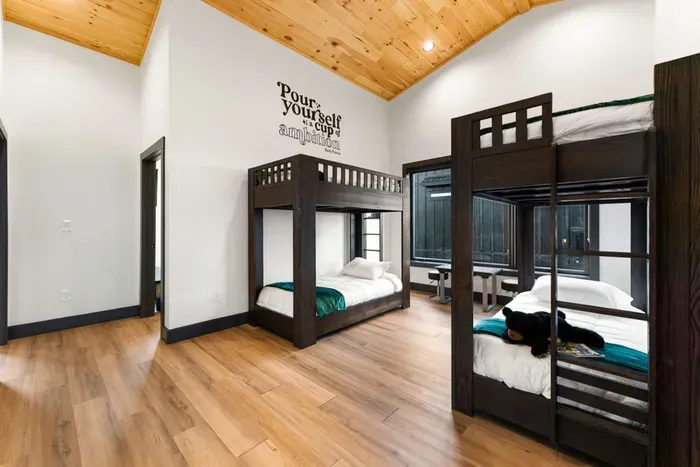Twin bunk beds in the loft area with a game table for the kids to enjoy!