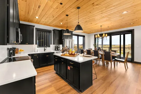 Fully equipped kitchen with modern appliances and ample space to cook and gather.