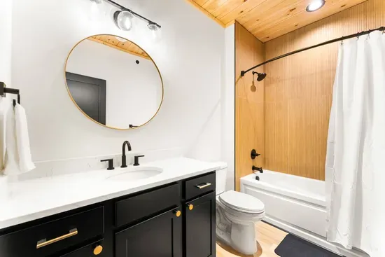 Spacious bathroom with a tub and shower.
