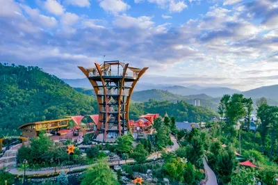 Panoramic mountain-view tower with gardens, paths & scenic decks