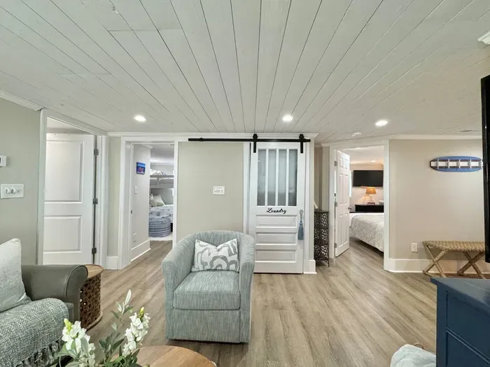 Open living room with stackable washer/dryer available