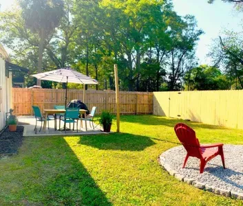 Grill and Chill in the private fully fenced backyard. Cafe lights, Propane Grill and Firepit