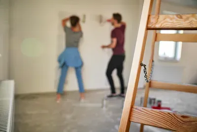 couple-renovating-home-together-with-wooden-ladder-2026-03-13-01-59-03-utc