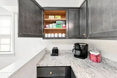 Well-stocked coffee nook with modern finishes and handy guest amenities