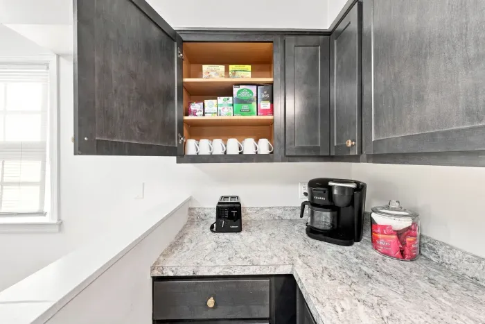 Well-stocked coffee nook with modern finishes and handy guest amenities