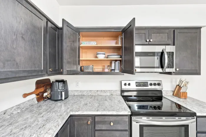Modern kitchen with stainless appliances and spacious counters