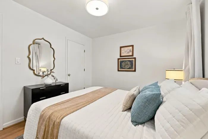 Bright, cozy bedroom with elegant decor and a restful, inviting feel