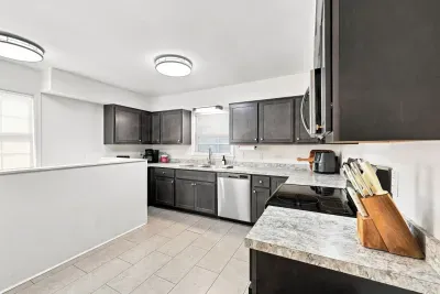 Bright modern kitchen with stainless appliances and ample counter space