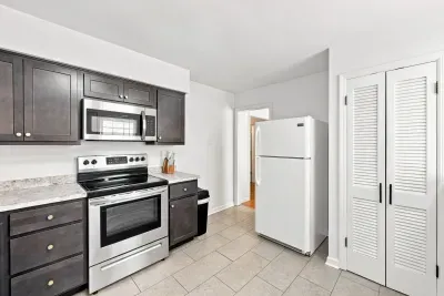 Bright kitchen with stainless appliances and ample storage