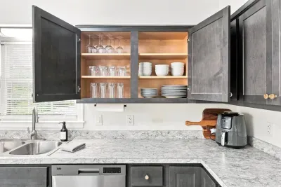 Bright modern kitchen with spacious counters and fully stocked cabinets