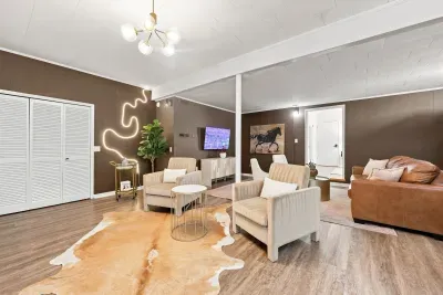 Stylish, spacious lounge with cozy seating and modern designer touches