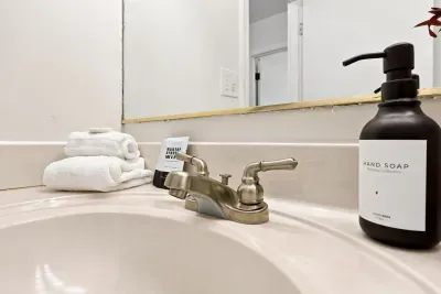 Clean bathroom vanity with fresh towels and modern touches
