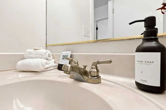 Clean bathroom vanity with fresh towels and modern touches