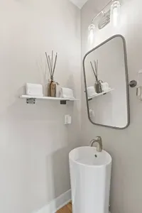Located on the first floor, this half bath is stylish and convenient!