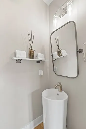 Located on the first floor, this half bath is stylish and convenient!