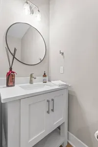 Located on the second floor off of the kitchen, this half bath is in the perfect location if you are in the kitchen, living room or patio.