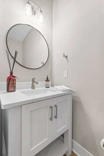 Located on the second floor off of the kitchen, this half bath is in the perfect location if you are in the kitchen, living room or patio.