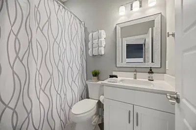 Full private bath to the queen bedroom including plush towels, shampoo, conditioner, and body wash for your convenience.