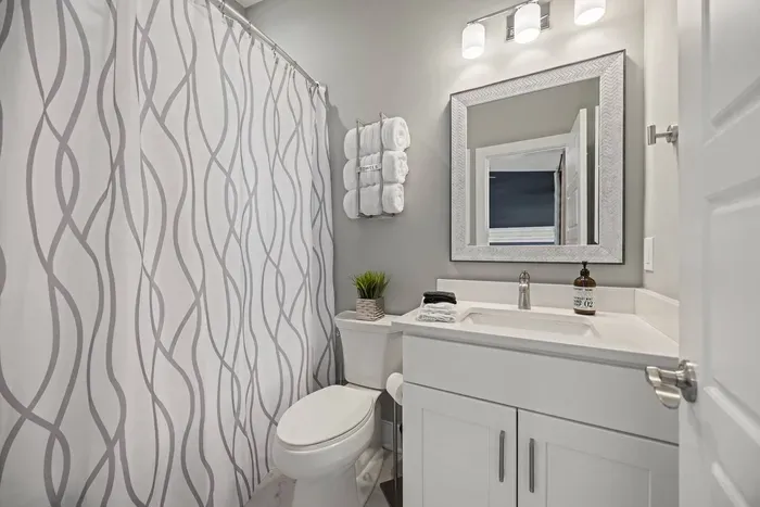 Full private bath to the queen bedroom including plush towels, shampoo, conditioner, and body wash for your convenience.