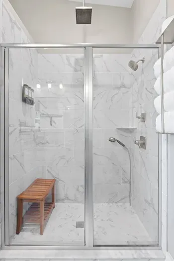 Full walk-in shower with body spray and Rainfall shower head.