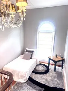Twin bed, can be converted to a sofa / sitting area, located in the upstairs loft area open to hallway. Perfect for overnight guests.