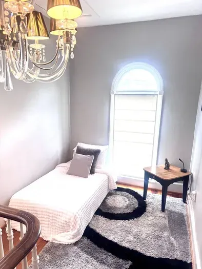 Twin bed, can be converted to a sofa / sitting area, located in the upstairs loft area open to hallway. Perfect for overnight guests.