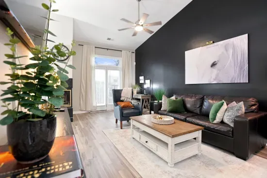 Bright, stylish living room with vaulted ceilings and cozy seating