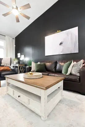 Stylish vaulted living room with leather seating and bold modern design