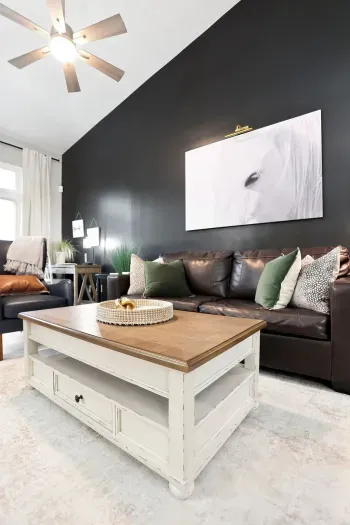 Stylish vaulted living room with leather seating and bold modern design