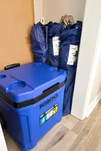 Bonus guest gear: rolling cooler and foldable chairs for easy outdoor adventures