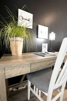 Chic workspace with rustic desk, accent wall, and cozy designer touches