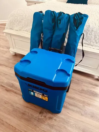 Rolling cooler and 4 chairs available for your tailgating needs