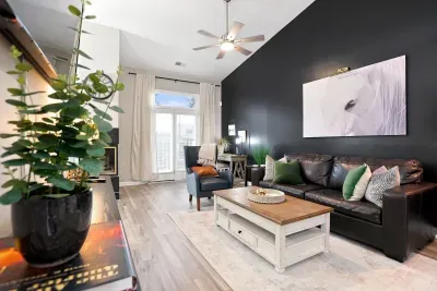Bright, stylish living room with vaulted ceilings and cozy modern seating