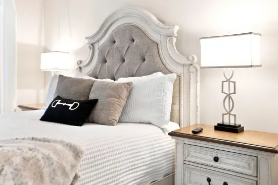 Elegant bedroom with a statement headboard and soft, layered bedding