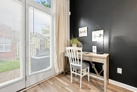 Bright work nook with desk, natural light, and sleek modern style