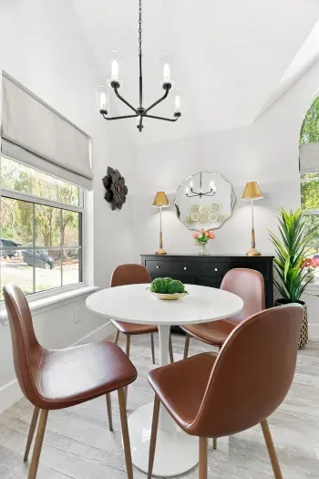 Bright modern dining nook with stylish seating and abundant natural light