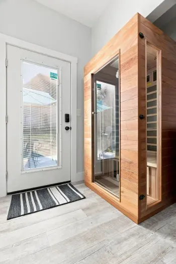 Private indoor sauna by the entry for a relaxing spa-like retreat