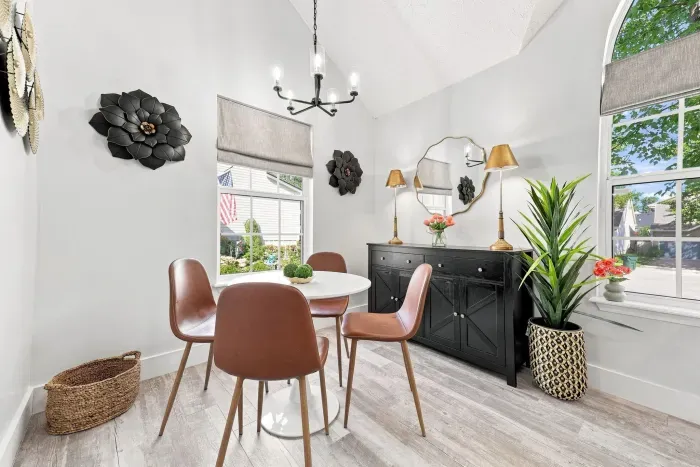 Bright, stylish dining nook with vaulted ceilings and abundant natural light