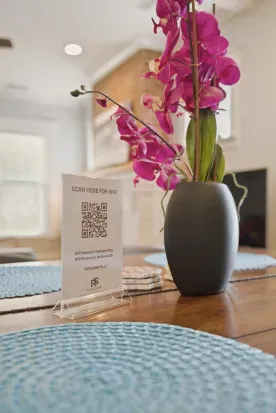 Stylish dining table with fresh orchids and easy Wi-Fi access
