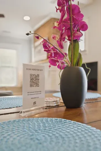 Stylish dining table with fresh orchids and easy Wi-Fi access