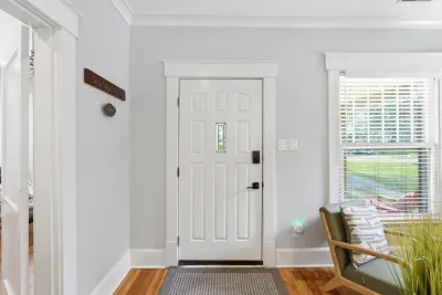 Bright, welcoming entryway with hardwood floors and natural light