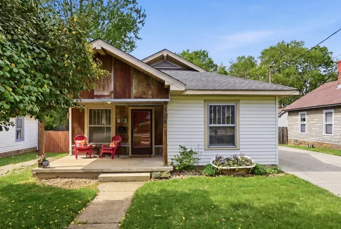Charming home with cozy front porch, shaded yard, and private driveway