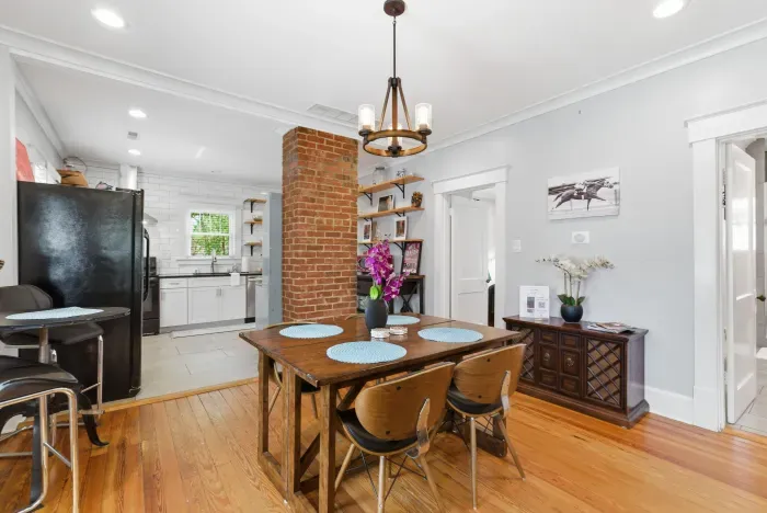 Bright dining space with rustic charm and an updated open kitchen