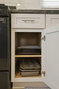 Well-stocked kitchen storage with baking essentials close at hand