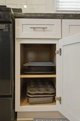 Well-stocked kitchen storage with baking essentials close at hand