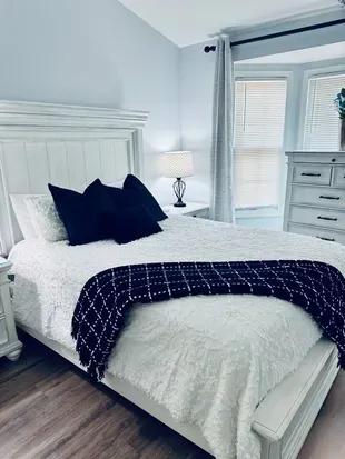 Queen size bed with extra bedding
