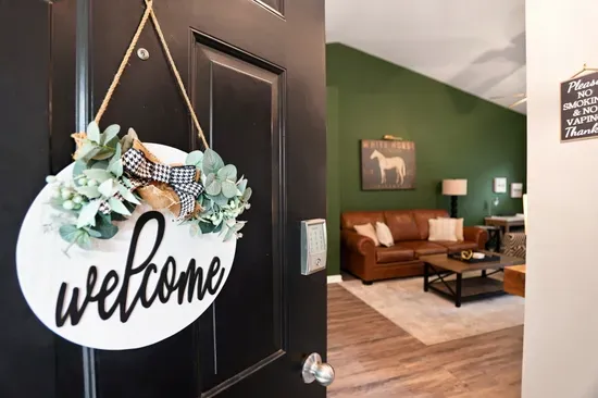 Warm welcome entry opens to a cozy, stylish living room retreat