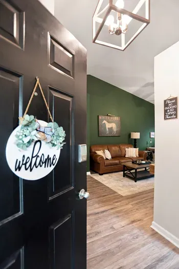 Warm welcome entry with stylish living room and cozy leather seating