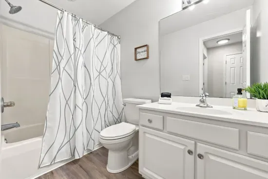 Bright full bath with tub/shower combo and spacious vanity