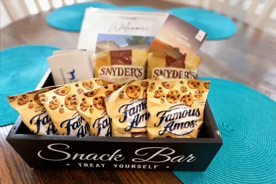 Welcome snack bar with sweet treats, pretzels, and thoughtful guest touches